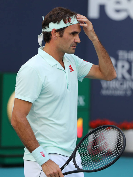 MIAMI GARDENS, FLORIDA - MARCH 27, 2019: Grand Slam champion Roger Federer of Switzerland in action during his round of 16 match at 2019 Miami Open at the Hard Rock Stadium in Miami Gardens, Florida - Φωτογραφία, εικόνα
