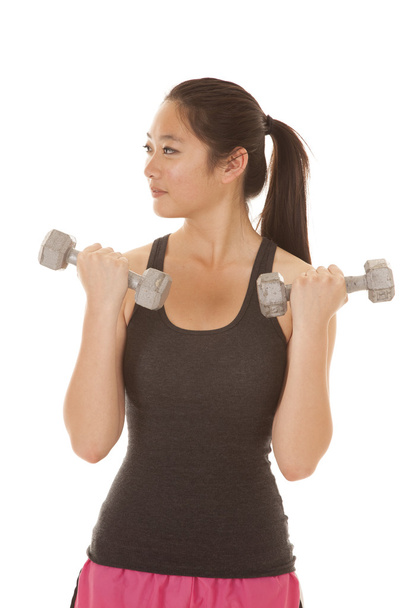 Asian woman curl weights look side - Фото, зображення