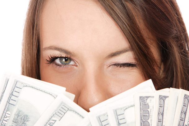 Attractive woman takes lot of 100 dollar bills - Photo, image