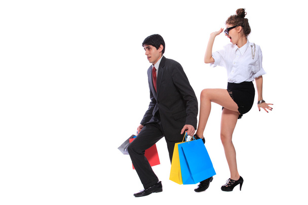 Sexy shopping couple holding bags - Foto, imagen