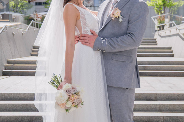 bride and groom on the big staircase - Fotoğraf, Görsel