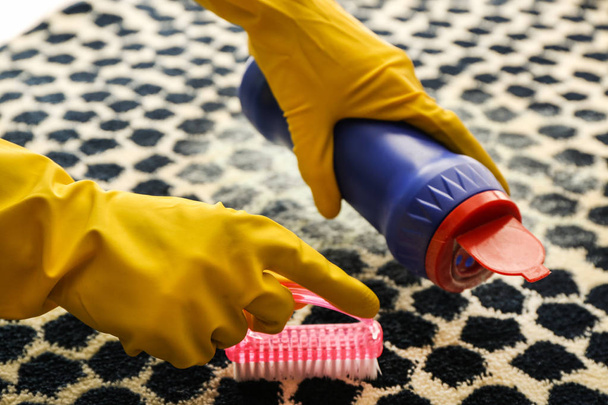Woman cleaning carpet - Photo, Image