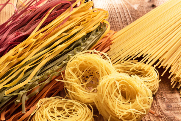 top view different types, colour of pasta and geometric shape on the table - 写真・画像