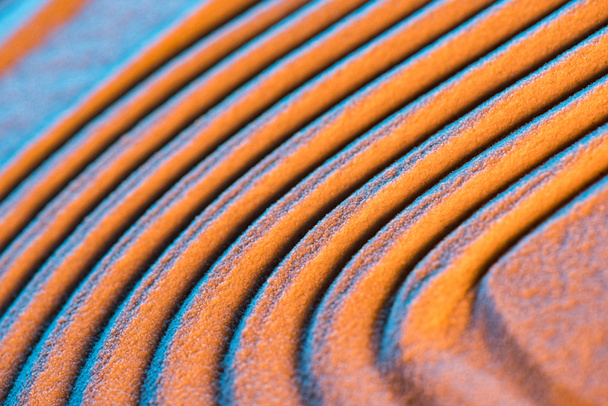 close up view of textured sand background with lines and color filter - Fotó, kép