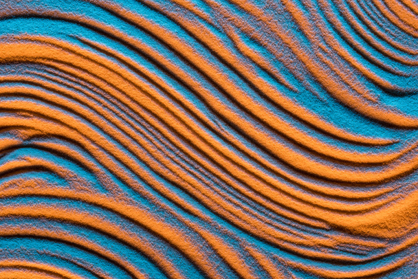 top view of abstract wavy background with textured sand and color filter - Photo, Image