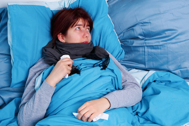 Photo of sick brunette lying in bed - Photo, Image