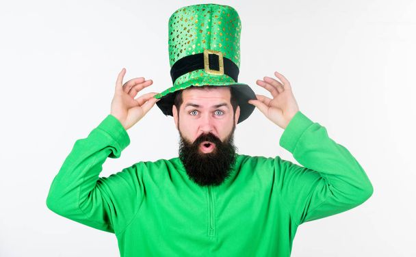 Myth of leprechaun. Man bearded hipster wear green clothing and hat patricks day. Saint patricks day holiday. Green color part of celebration. Happy patricks day. Global celebration of irish culture - Фото, изображение