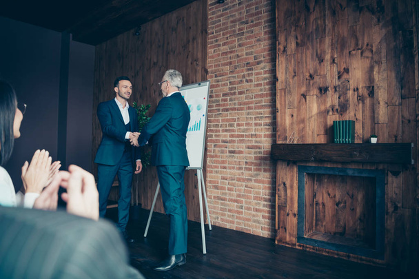 Profile side view of nice stylish elegant sharks marketers ceo boss chief shaking hands welcome to new start-up finance project at modern industrial loft interior work place space indoors - Fotografie, Obrázek