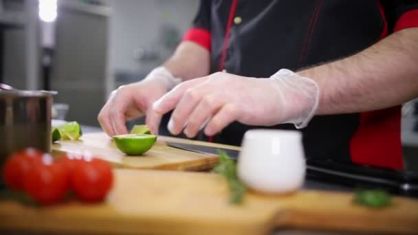 A chef working in the kitchen. Preparing the lime for serving - Footage, Video