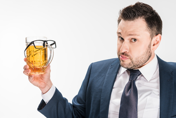 chubby man in formal wear looking at camera while holding glass of beer with glasses on isolated on white - Fotoğraf, Görsel