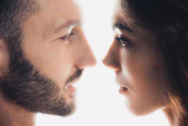cropped view of loving couple looking at each other isolated on white - Foto, Bild