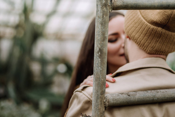 happy lovers boyfriend and girlfriend kissing, hugging in the garden - Foto, Bild