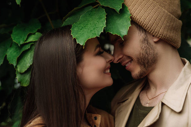 happy lovers boyfriend and girlfriend kissing, hugging in the garden - Foto, imagen