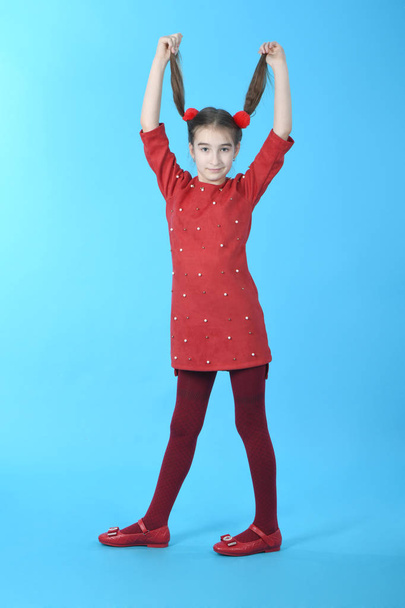 Full length studio photo girl wearing red dress standing - Foto, imagen