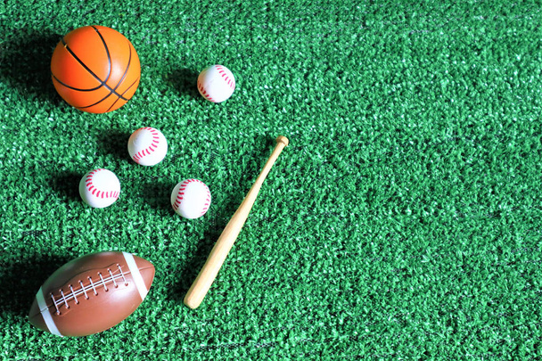 Sports accessories. sticks, balls on Green background.  - Foto, imagen