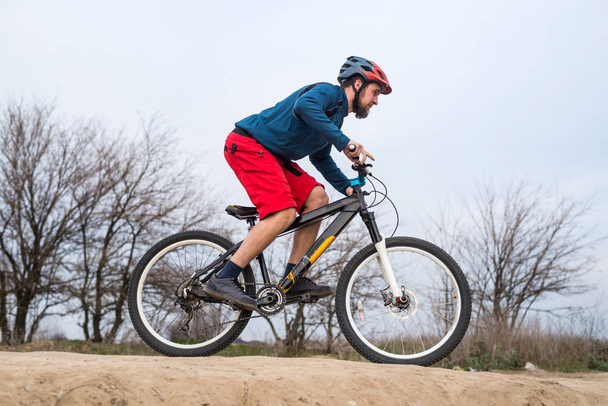 Athletic man riding a bike. lifestyle. - Foto, Bild