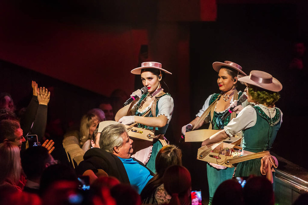 ODESSA, UKRAINE - MARCH 17, 2019: Bright music show FREEDOM JAZZ. Beautiful female jazz band on stage in a bright musical jazz show. Sexy women musicians on stage in an erotic musical performance - Photo, Image