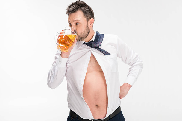 overweight man in tight shirt glass of beer isolated on white - Foto, imagen