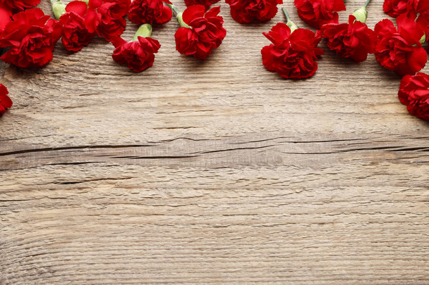 Red carnations on wood - Foto, Imagem
