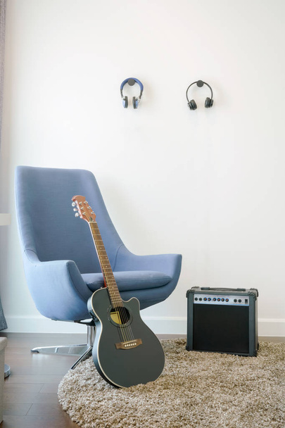 Music corner in the living room with retro style armchair, headp - Zdjęcie, obraz