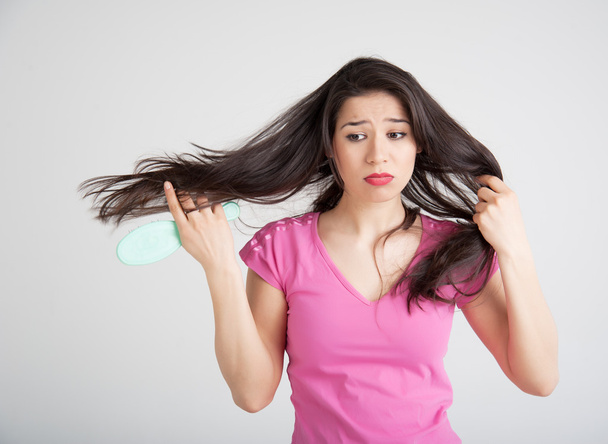 shocked woman losing hair on hairbrush - Foto, Imagem