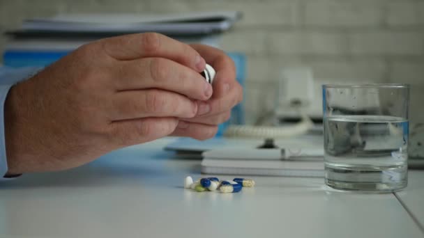 Suffering Businessman in Office Room Open a Recipient and Take Medical Pills - Felvétel, videó