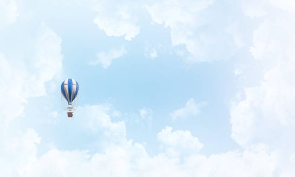 Colorful aerostat flying over the blue cloudy sky. 3D rendering. - Fotó, kép