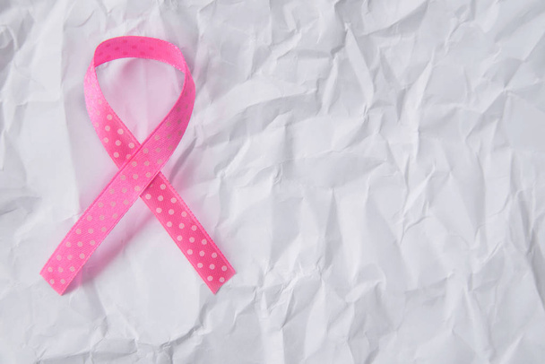 Pink  ribbon, symbol of breast cancer on white background. Cancer awareness month. - Photo, Image