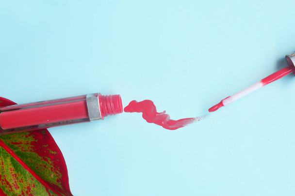 Pink lip gloss makeup isolated on pastel background,  Minimal ma - Фото, зображення
