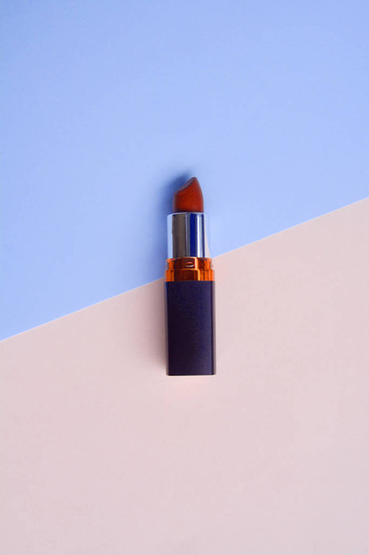 Red lipstick isolated on pastel background, Minimal makeup fashi - Фото, зображення