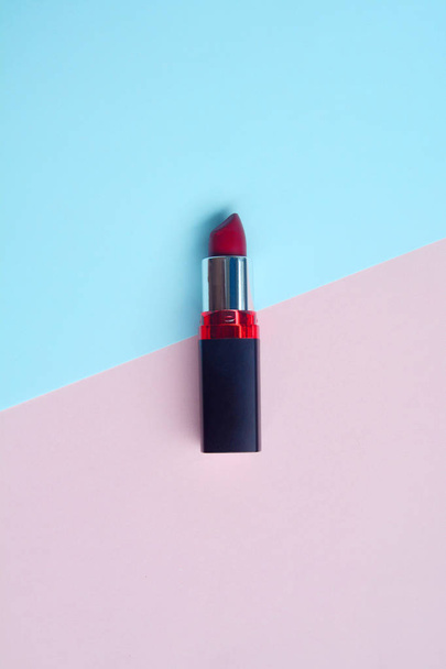 Red lipstick isolated on pastel background, Minimal makeup fashi - Fotoğraf, Görsel