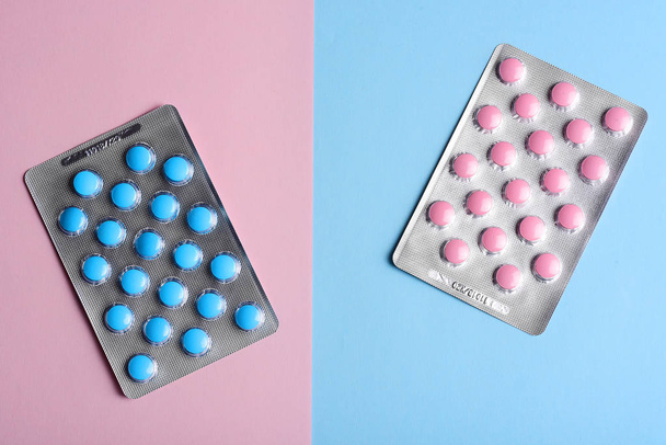 Pink and blue tablets on pastel background with copy space - Photo, Image
