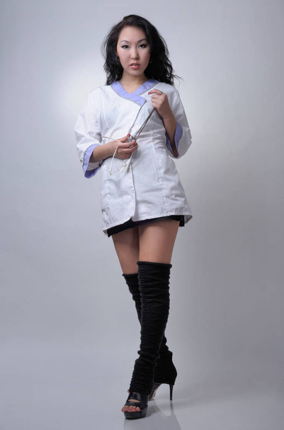 Sexy asian female nurse in white uniform - Photo, Image
