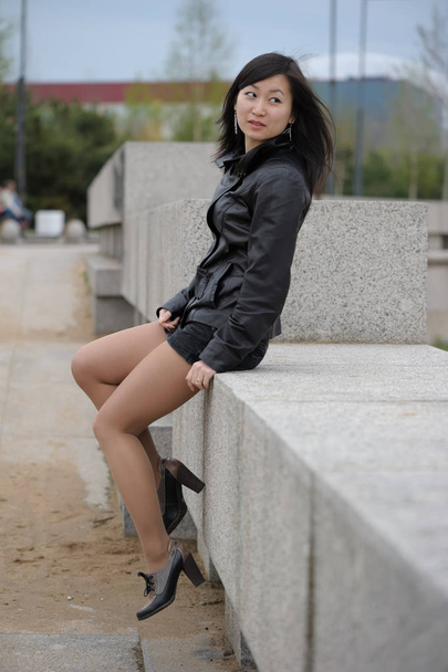 Asian girl in black jacket - Photo, image
