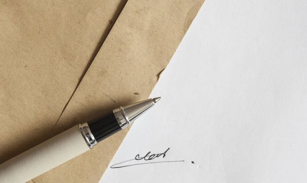 pen with signature and document in background - Photo, Image