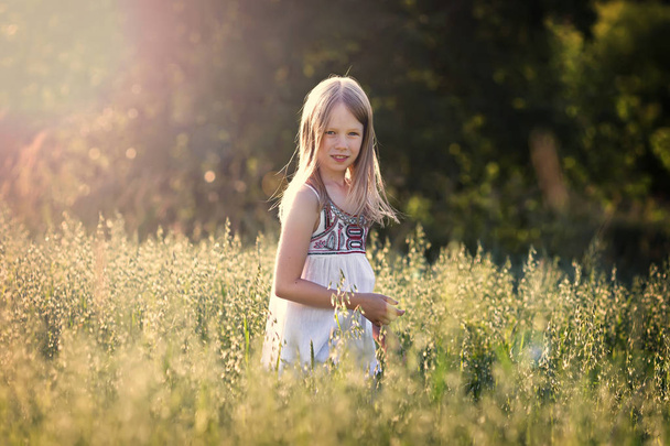 girl on a grain field - Photo, image