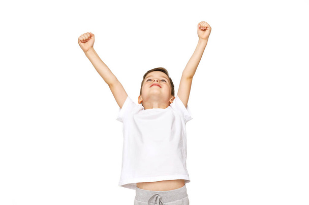 portrait of a boy with his hands up  - Фото, зображення
