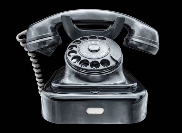 старий чорний телефон на чорному фоні
 - Фото, зображення