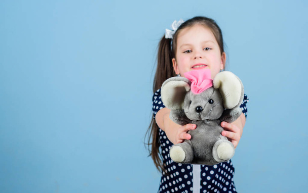 Happy childhood. Child care. Sweet childhood. Childhood concept. Lovely small girl with favorite toy. Kindergarten and educational games. Friendly babysitter. Kid cute girl play with soft toy mouse - Fotografie, Obrázek