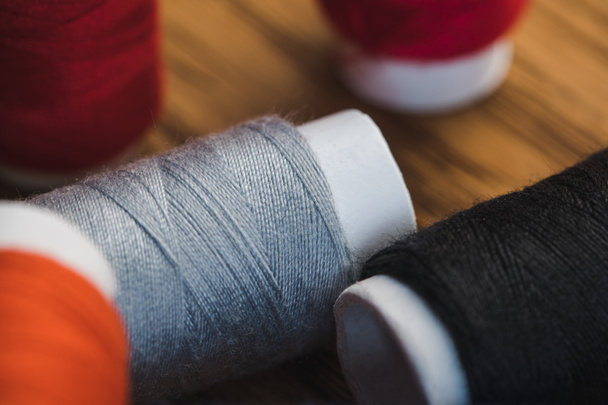 close up view of grey and black cotton thread coils - Photo, Image
