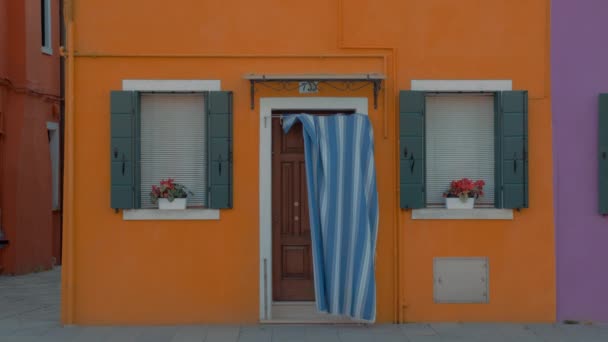 A bright yellow facade of a small house in Burano, Italy - Footage, Video