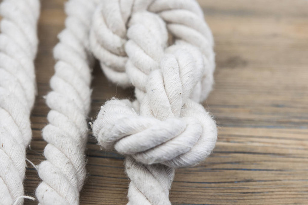 Close up of wooden panels with knot rope  - Photo, Image