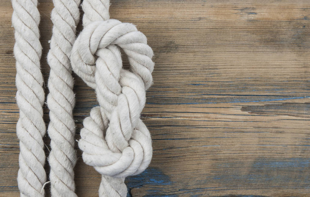 Close up of wooden panels with knot rope  - Foto, Bild