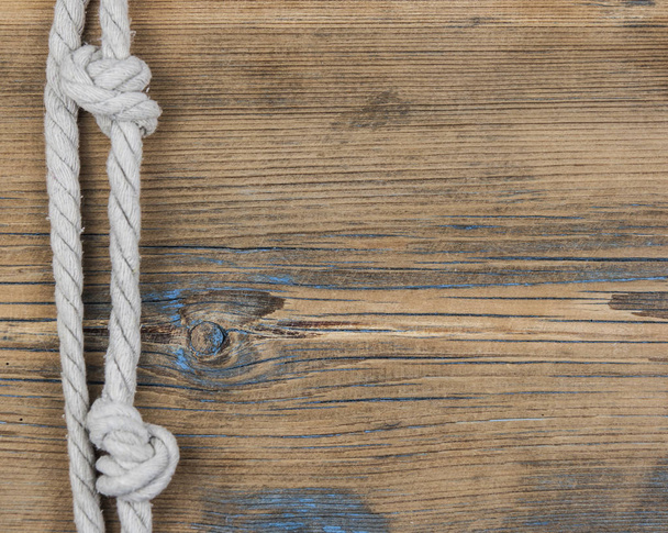 Close up of wooden panels with knot rope  - Photo, Image
