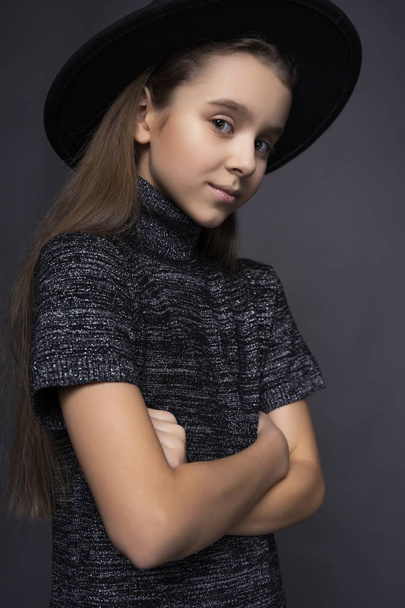 Portrait of beautiful cute teen girl wearing a dark turtleneck a - Photo, image
