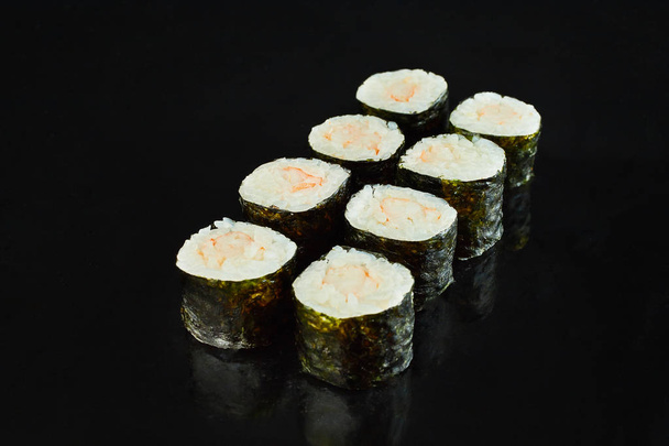 Classical roll sushi maki with shrimp isolated on black background for menu. Japanese food - 写真・画像