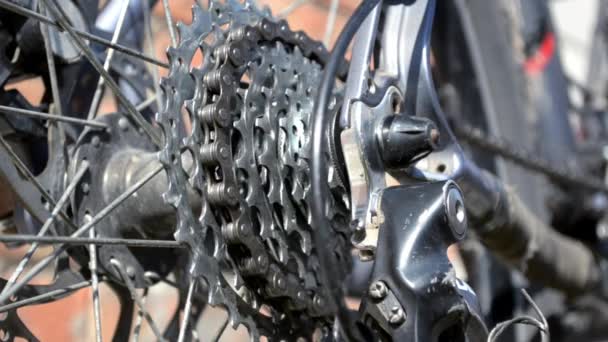 New cassette with gears and chain on the rear wheel of old gray bike, new transmission in work closeup - Footage, Video