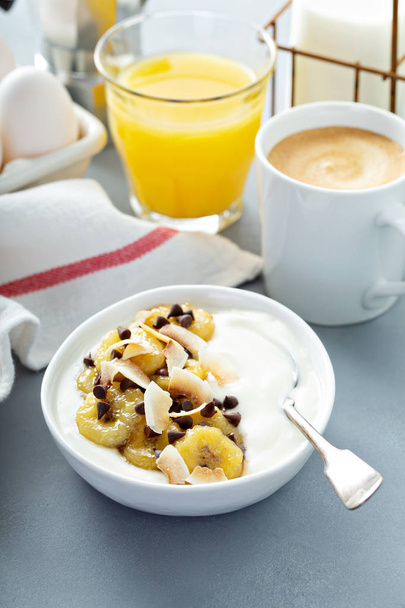 Plain yogurt with bananas, chocolate and coconut - Photo, image