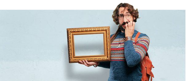 young hippie man with a baroque frame - Zdjęcie, obraz