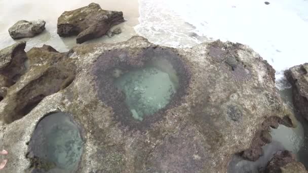 Amami Oshima, Japan - April 6, 2019: Heart-shaped tide pool at low tide at Akaogi district in Amami Oshima, Kagoshima, Japan - Footage, Video